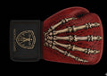 Gants de boxe MG1 Mortal Guard — profil, cuir rouge, main squelettique dorée, poignet noir